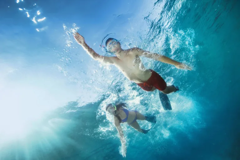 Snorkeling in the clear waters of Menai Bay Zanzibar, showing colorful coral and tropical fish.