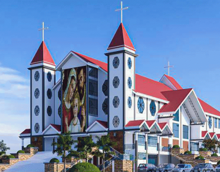 Tanzanian Christian congregation in colorful traditional attire outside a church in Arusha.