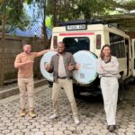 Leonissa and her husband Wellington with safari guide Kundaheli, ready for their Tanzania safari.