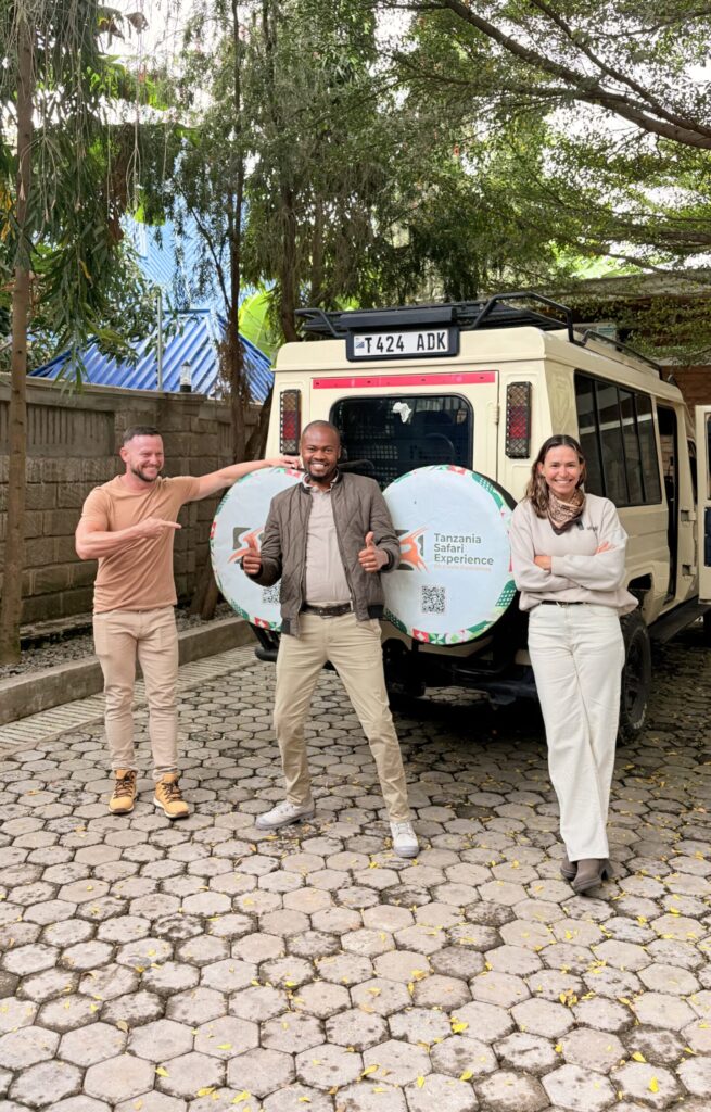 Tanzania Honeymoon Safari Leonissa and her husband Wellington with safari guide Kundaheli, ready for their Tanzania safari.